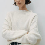 Model wears a Cream Knit