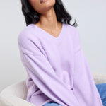 model wears a lilac v neckline long sleeve jumper