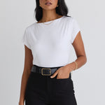 model wears a white tee