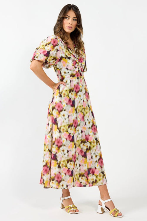 model wears a pink floral maxi dress