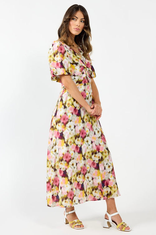 model wears a pink floral maxi dress