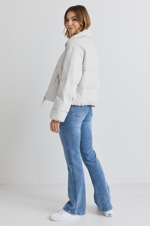 model wears a white puffer jacket