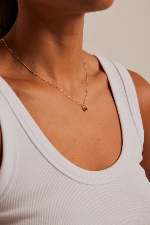 Model wears a Heart gold necklace