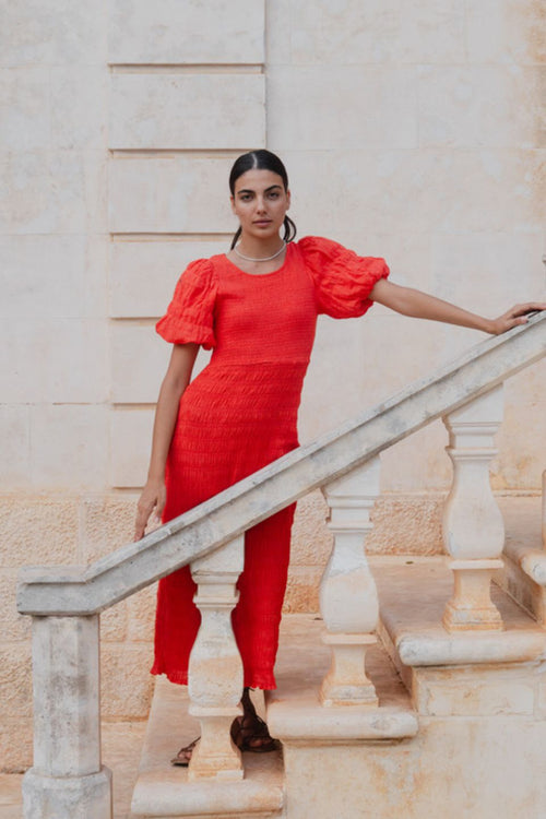 model wears a red puff sleeve midi dress