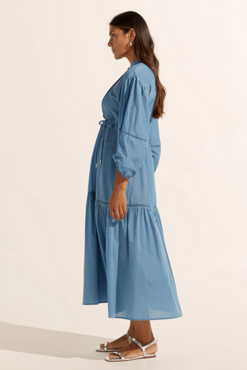 model wears blue long sleeve maxi dress