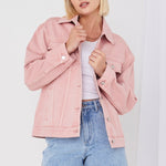 model wears pink denim jacket 