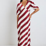 our model wears a plum stripe v neckline maxi dress