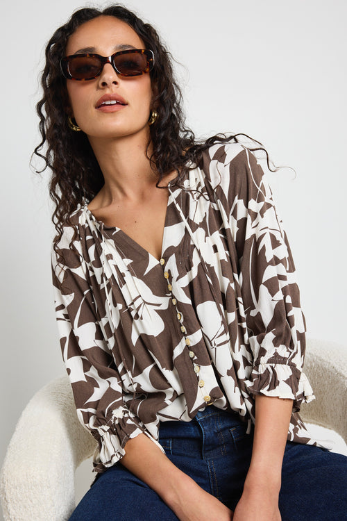 Mode wears a chocolate pattern print blouse top