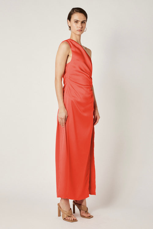 model wears a orange maxi dress