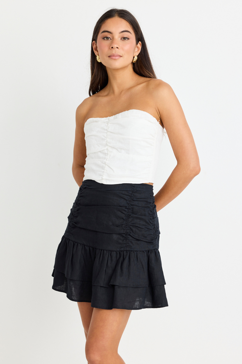 model wears White Linen Strapless Top