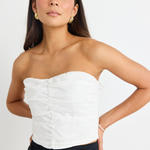 model wears White Linen Strapless Top