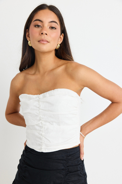 model wears White Linen Strapless Top