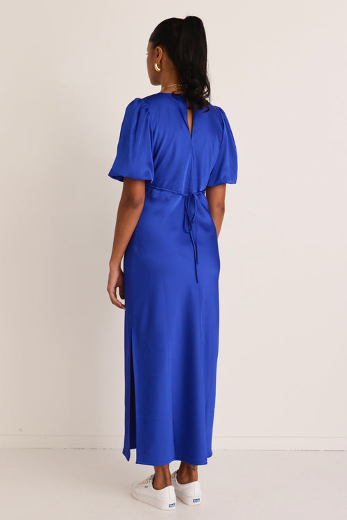 model wears a blue maxi dress