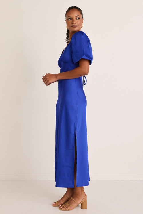 model wears a blue maxi dress