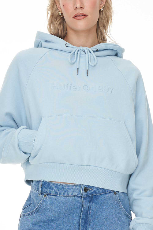  model wears a blue hoodie