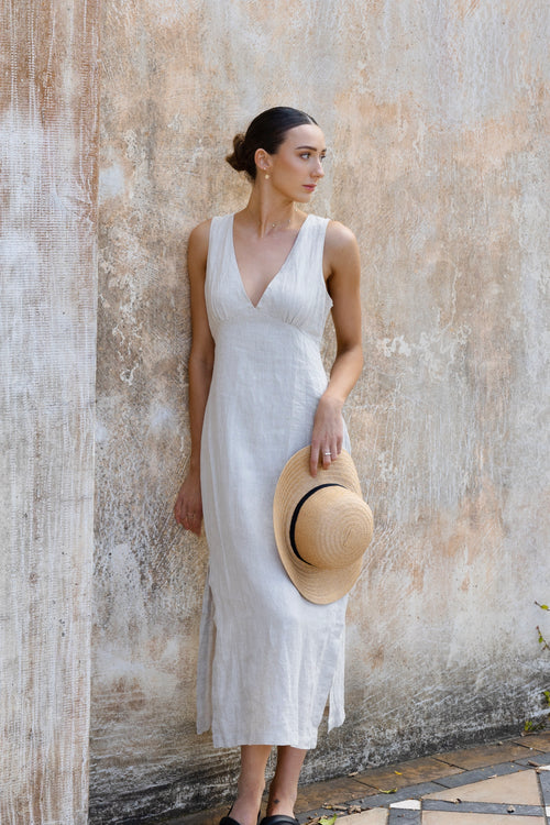 model wears linen v neck midi dress