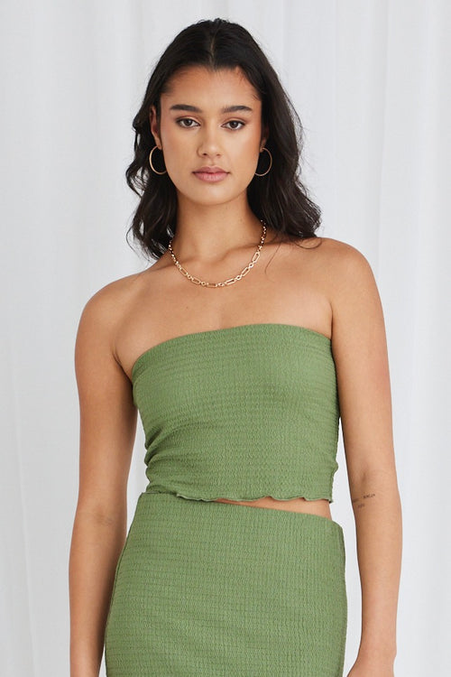 Model wearing green bandeau top and maxi skirt set