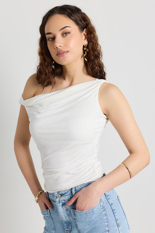 Model wears a white off shoulder top 