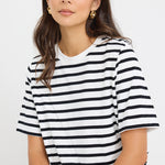 model wears a black and white stripe tee