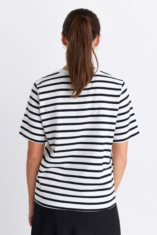 model wears a black and white stripe tee