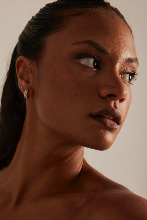 model wearing Chain Hoop Rhodium Earrings