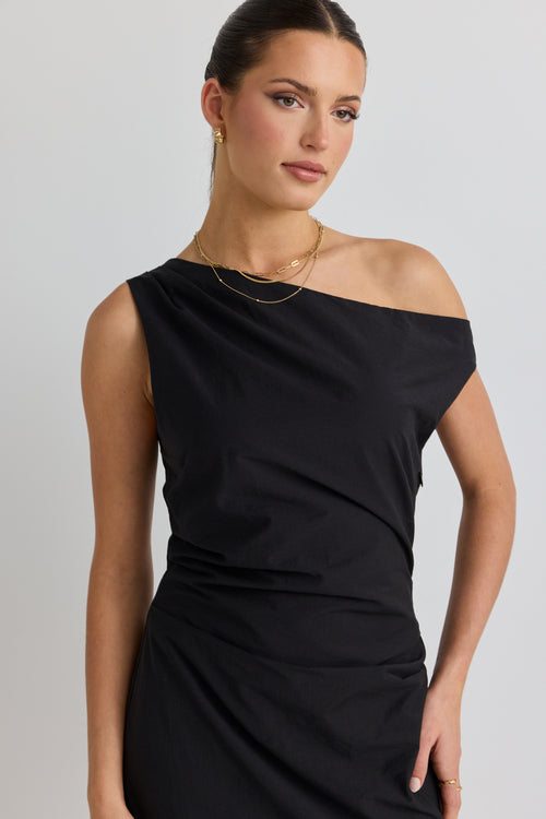 model wears a black one shoulder dress