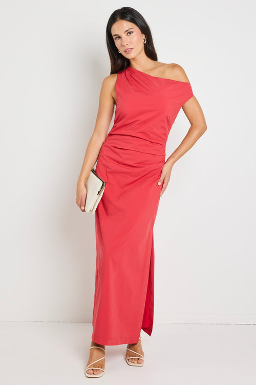 Woman wearing a bold red one-shoulder dress with flattering ruching, perfect for a glamorous night out.