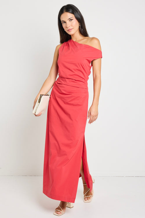 Woman wearing a bold red one-shoulder dress with flattering ruching, perfect for a glamorous night out.