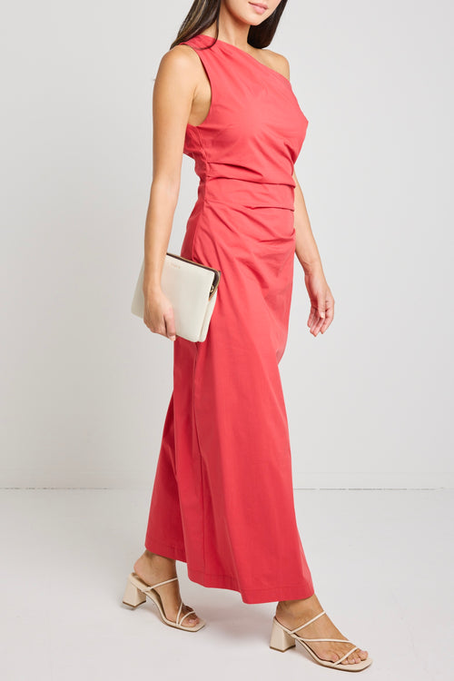 Woman wearing a bold red one-shoulder dress with flattering ruching, perfect for a glamorous night out.