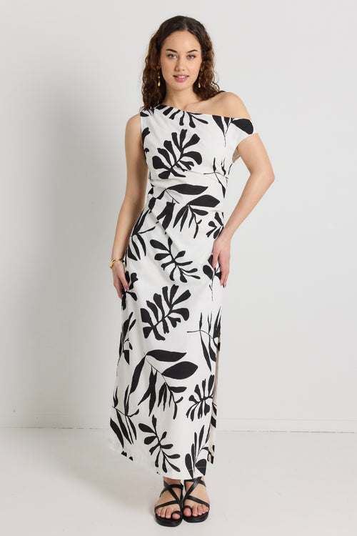 model wears a black and white maxi dress