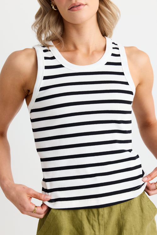 model wears a white black stripe singlet