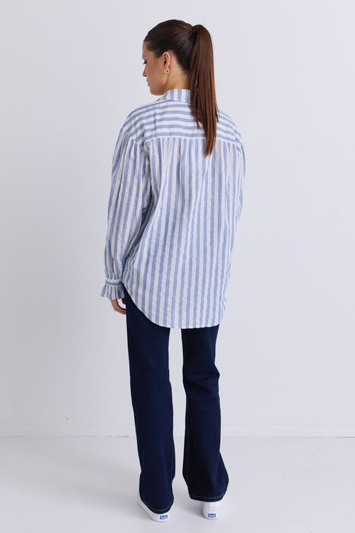 model wears a blue and white stripe shirt