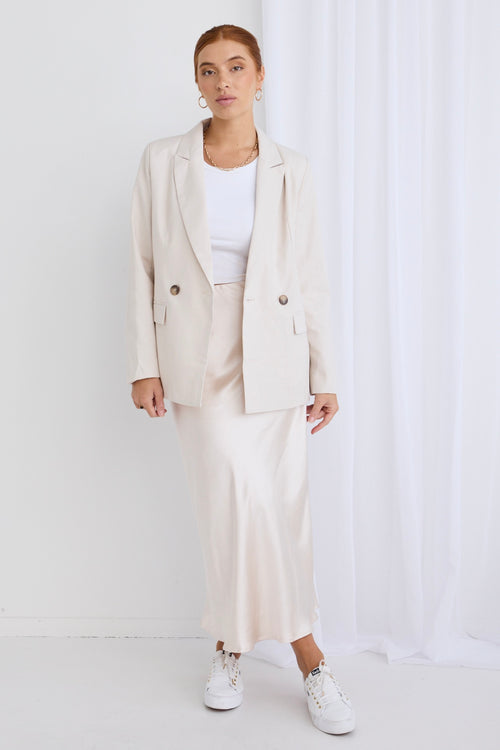 model wears a beige linen blazer