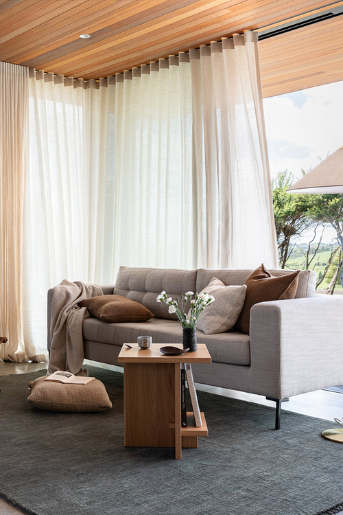 brown rectangular cushion on cushion