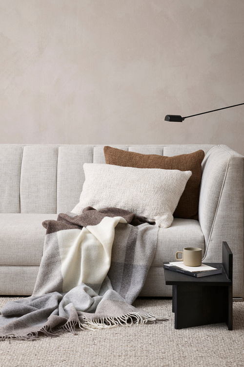 brown rectangular cushion on cushion