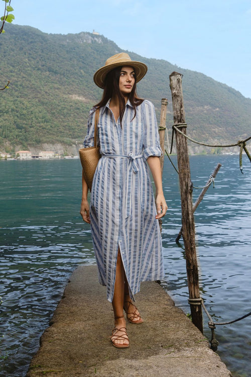 model wears blue and white stripe midi dress