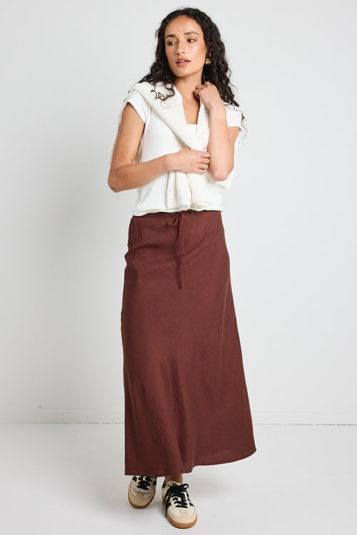 Model wears a linen tie waist maxi skirt