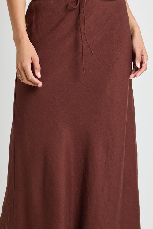 Model wears a linen tie waist maxi skirt