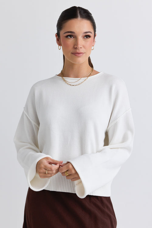 Model wears a white knit