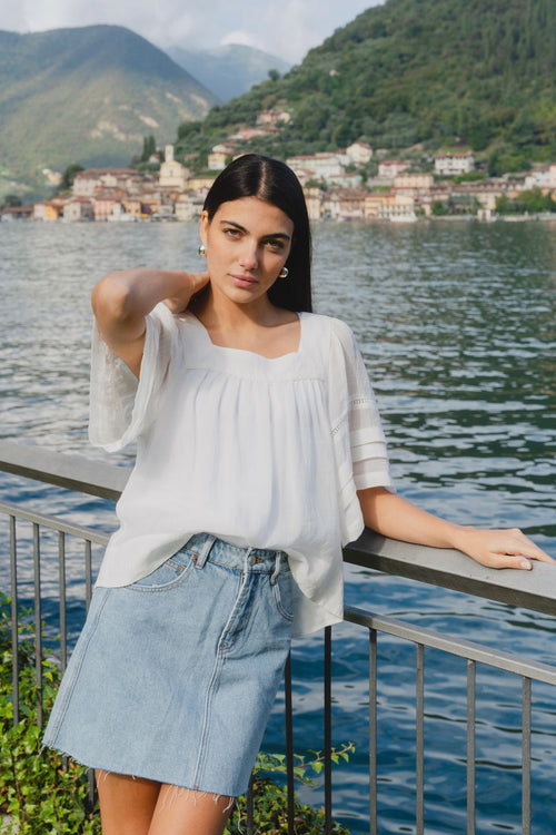 model wears a denim mini skirt