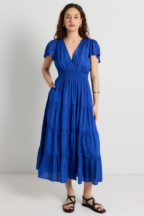 model wears Blue Shirred Maxi Dress