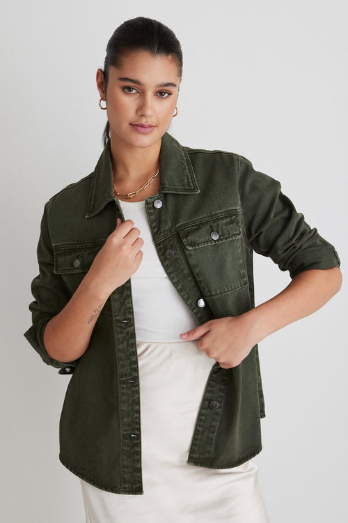 Model wears a green denim shacket