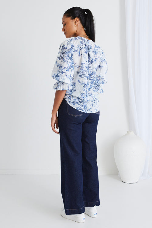 Model wears a blue floral top