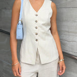 model wears a linen vest