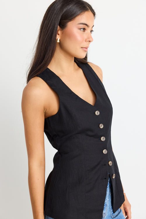 model wears black linen vest