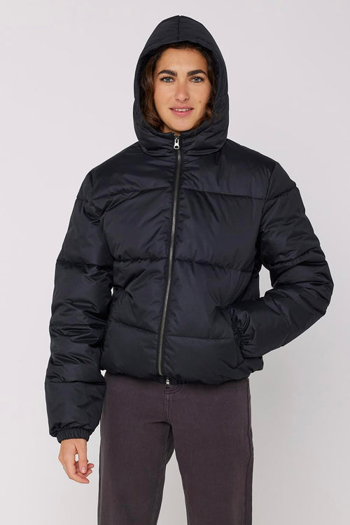 model wears a black puffer jacket