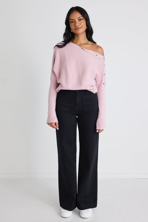 Model wears a pink batwing jumper