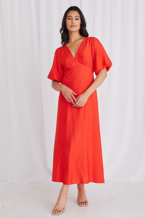 model wears a red maxi dress