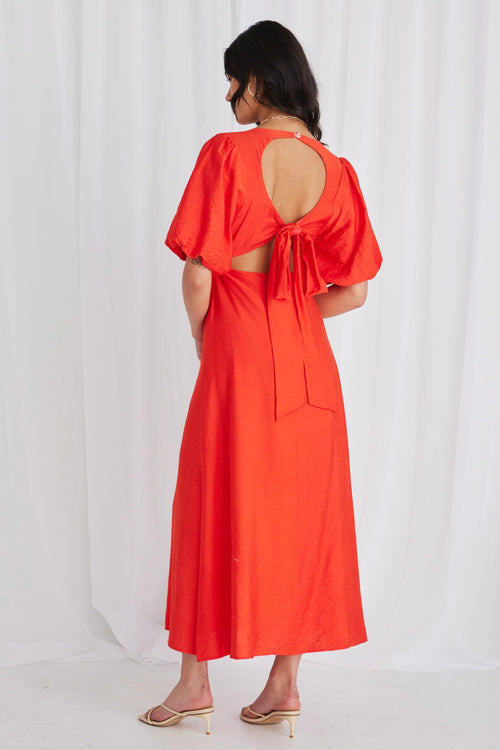 model wears a red maxi dress