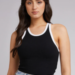 model in black tank with white lining and blue jeans